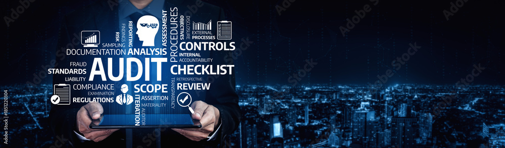 Obraz premium A businessman presents a digital tablet showcasing audit terms and concepts against a dark city skyline at night, highlighting financial review and compliance themes. Tessel