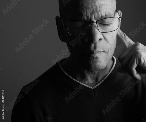 deafness suffering from deafness and hearing loss Senior man cupping his ear having difficulty hearing on gray background with people stock photo stock image