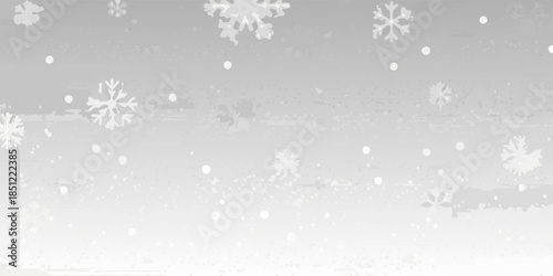 Soft snowfall with delicate snowflakes gently falling against a muted gray background