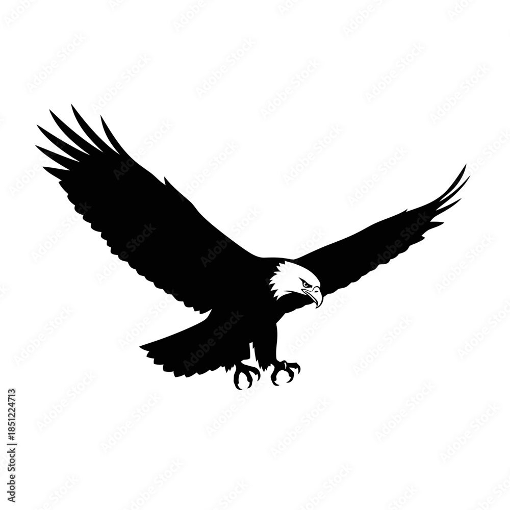 Fototapeta premium A majestic bald eagle soars through the air with wings fully extended in flight