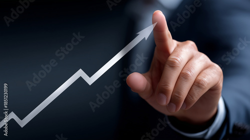 businessman touching growth graph arrow line going up with business plan or market analysis on virtual screen, rising and growing concept of large "monstrous" figures. business suc