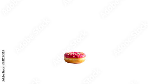 A single frosted donut with sprinkles against a black background