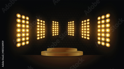 A dimly lit stage with bright yellow lights and a circular platform