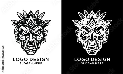 Intricate black and white illustration of a fierce tribal mask with sharp teeth and ornate headdress.