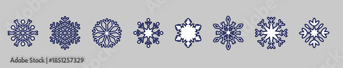 A collection of detailed snowflake designs in blue, perfectly arranged on a gray backdrop.