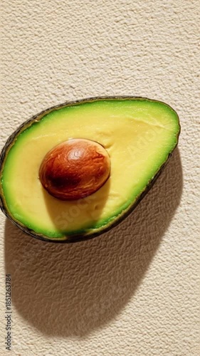 Fresh Avocado Half with Pit on Textured Surface - Healthy Food Photography