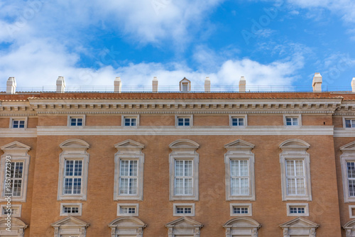 Bild auf Leinwand Neoclassical facade detail of the Royal Palace of Caserta with chimneys and wind