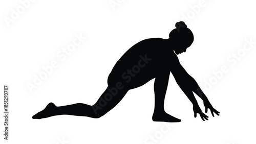Silhouette of a person doing a yoga pose on the ground