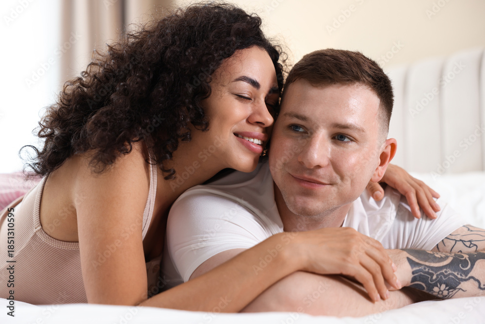 Fototapeta premium Lovely couple enjoying each other in bed at home