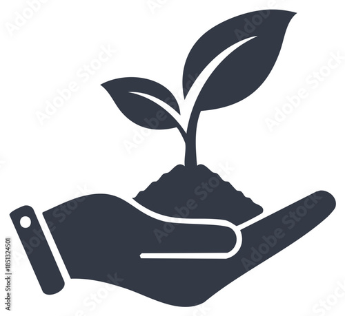 Hand holding seedling with soil and two leaves symbolizes growth and new beginnings