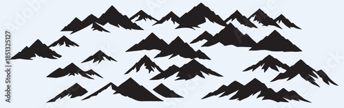 Dramatic black mountain silhouettes against light background