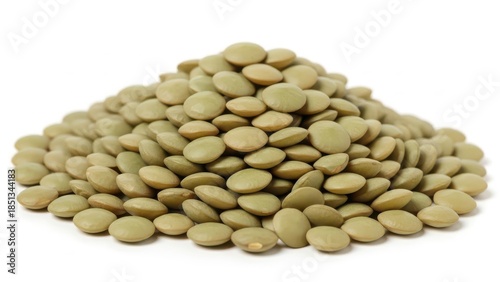Close-up of a pile of green lentils on white background.