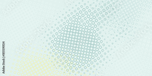 Abstract geometric pattern of small circles in light blue and green hues.