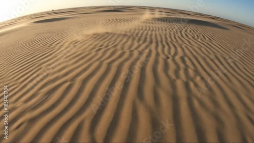Expansive Desert Dunes with Intricate Ripples Under Clear Blue Sky