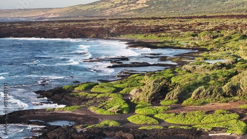 Panoramic view of Hawaii coastline near Punaluʻu Beach black sand landscape with ocean waves and volcanic coastlines on the Big Island in Hawaii County, Hawaii during morning sunrise - 4K Drone 
