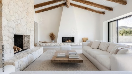 Farmhouse interior with stone fireplace, modern sofa, and neutral color palette