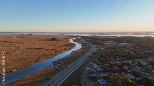 Aerial overview of the marsh, Turtle River, and the Sidney Lanier Bridge in Brunswick, GA