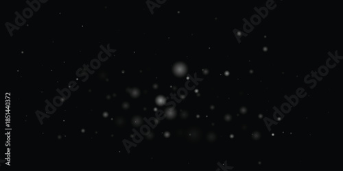 Abstract black background with blurry bokeh lights. Glowing dots with soft focus effect.