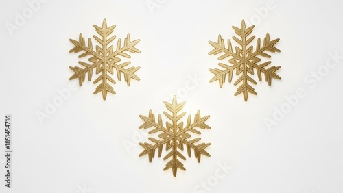 Three Golden Snowflake Ornaments on White Background