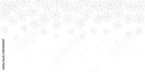 White winter background with a seamless pattern of many snowflakes with different sizes