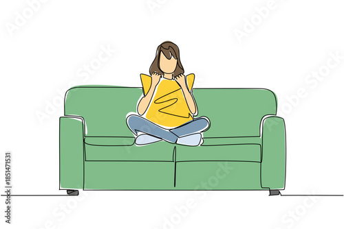 One line drawing of a woman sitting cross legged on a couch, holding and cuddling pillow to her chest, engrossed in a movie alone, symbolizing comfortable solitude and personal entertainment.