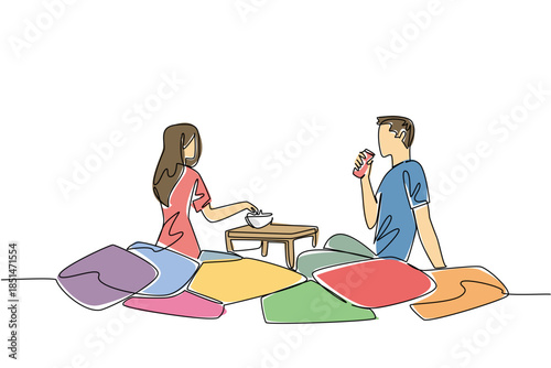 Continuous line draw of couple sitting on colorful floor cushions. Creative cozy setup, snacks, and relationship happiness while in living spaces for extra comfort and fun, National Movie Night event
