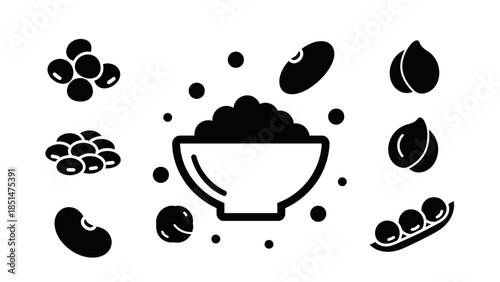 Variety of Beans: An assortment of black beans, each with its unique shape and texture, scattered around a central bowl, symbolizing nourishment, and offering a visual feast.
