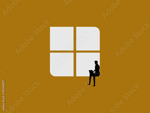 Businessman working on laptop on windowsill