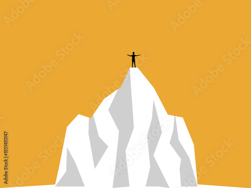 Businessman raises his hands in joy at his success on top of a snowy mountain.