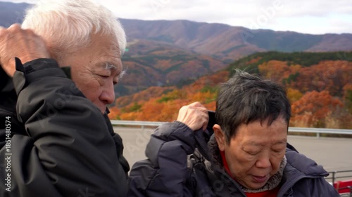 Happy senior couple travel in Autumn Winter Japan fun retirement trip experience 4k