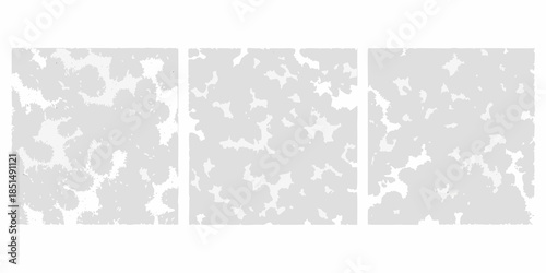 Abstract triptych of textured gray panels with irregular patterns