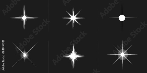 A collection of sparkling starbursts and light effects on a black background