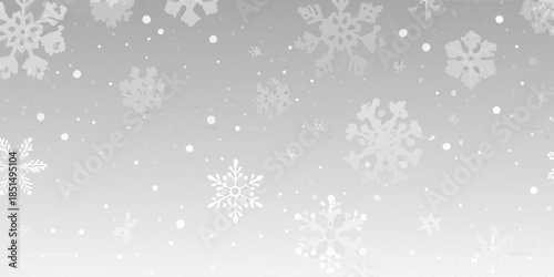 Delicate white snowflakes falling against a soft light gray background