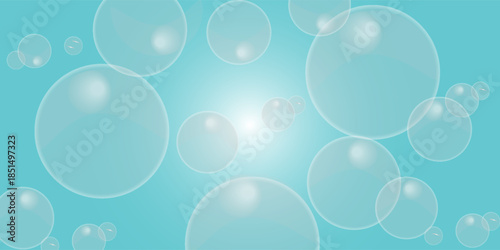 Many bubbles of various sizes on a light blue background. large and small water bubbles.