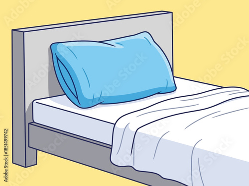 A serene bedroom scene with a rolled blue pillow on a neatly made bed viewed from the side.