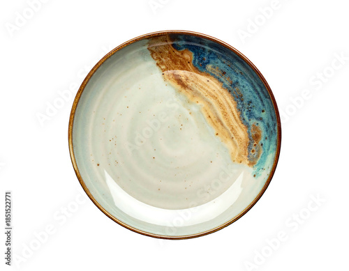 A ceramic plate showcasing a two-tone, abstract design with brown and blue glazed accents against an off-white backdrop. Rimmed in a darker tone