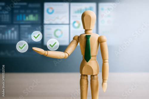 Wooden mannequin with green tie presenting check marks in office with charts and graphs in background, symbolizing success and approval in business and marketing