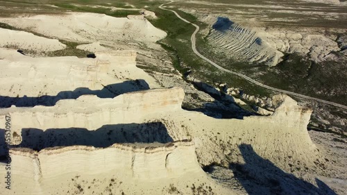 The Akkergeshen (or Akkegershin) limestone plateau in the Atyrau region, Kazakhstan. The Cretaceous Highlands. Nature-carved sculptures. The snow-white castles of the Caspian Plateau. Drone.4K