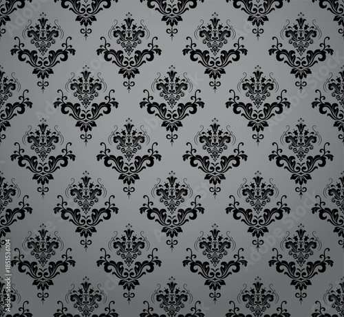 Wallpaper in the style of Baroque. Gray and black floral ornament. Seamless vector background. Graphic pattern for fabric, wallpaper, packaging. Ornate Damask flower illustration