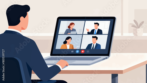A man is sitting at a desk with a laptop open. He is looking at a screen with four other people on it. The man is wearing a suit and tie. Concept of professionalism and collaboration