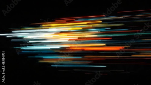 A dynamic abstract image showcasing vibrant, blurred light streaks against a black background, representing high speed and motion in technology innovation.
