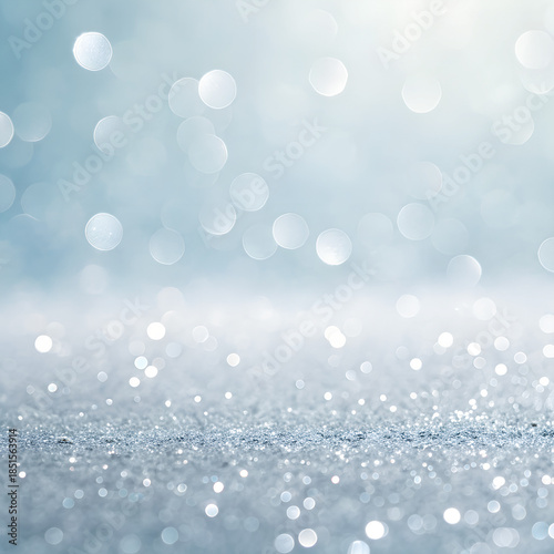 Sparkling winter landscape: A luminous expanse of light blue hues and glistening particles. Capturing a tranquil scene, suggesting an atmosphere of serenity.