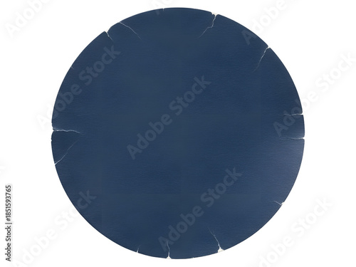 A dark blue circular object with subtle radial creases on a white background.