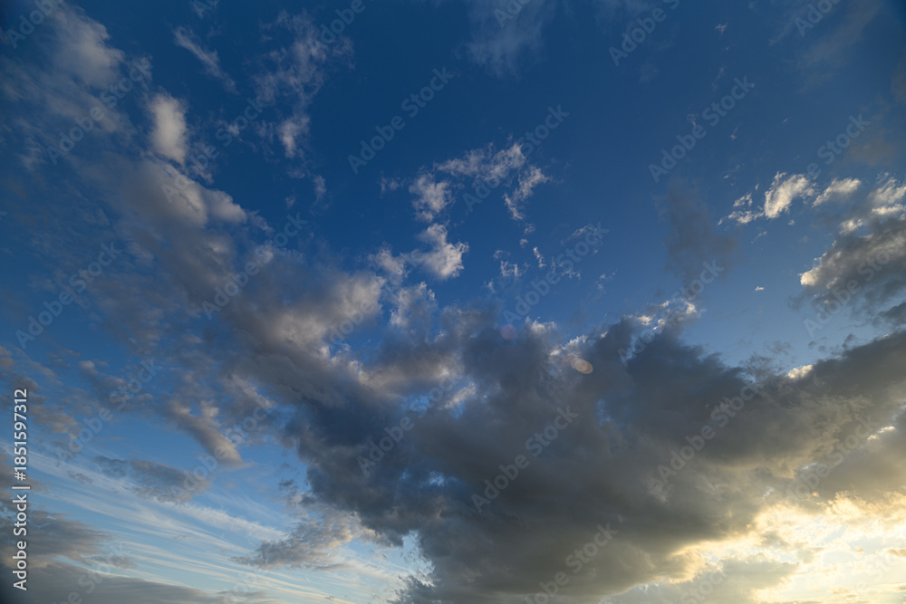 Obraz premium A Stunningly Beautiful Sky with Clouds at Beautiful Sunset, Radiating Vibrant Colors