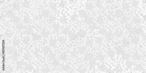 A grainy textured gray and white abstract background with speckled patterns