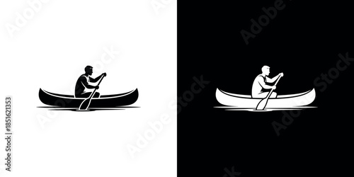 A lone figure peacefully paddles a canoe on still waters black and white