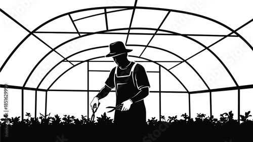 Silhouette of a farmer tending plants inside a greenhouse using pruning shears and wearing a hat