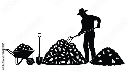 Gardener silhouette raking autumn leaves into a large pile with a wheelbarrow nearby