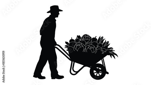 Silhouette of a farmer pushing a wheelbarrow overflowing with fresh harvested garden vegetables
