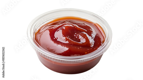 Rich dark barbecue sauce served in a small clear plastic condiment dipping cup on black on transparent background